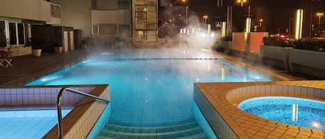 Seasonal outdoor pool, open 9:00 AM to 7:00 PM, pool umbrellas