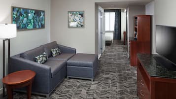 Premium bedding, desk, laptop workspace, blackout curtains