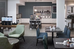 Relax in our welcoming lobby, featuring comfortable seating and a self-service buffet.