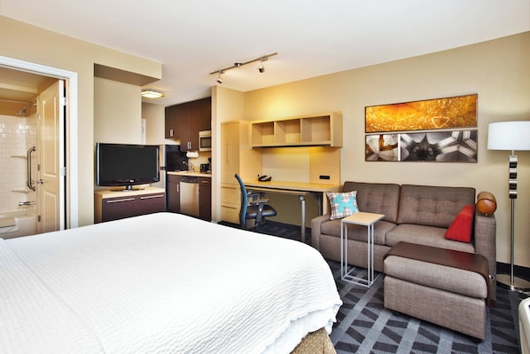 Hypo-allergenic bedding, desk, laptop workspace, blackout drapes