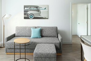 Premium bedding, desk, laptop workspace, blackout drapes