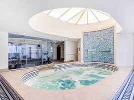 Indoor pool, open 6:00 AM to 10:00 PM, sun loungers