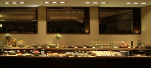Enjoy a sumptuous spread of fresh fruits, pastries, and dishes at our inviting buffet.