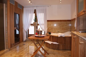 A modern bathroom with a wooden vanity, a bathtub, and a large mirror.