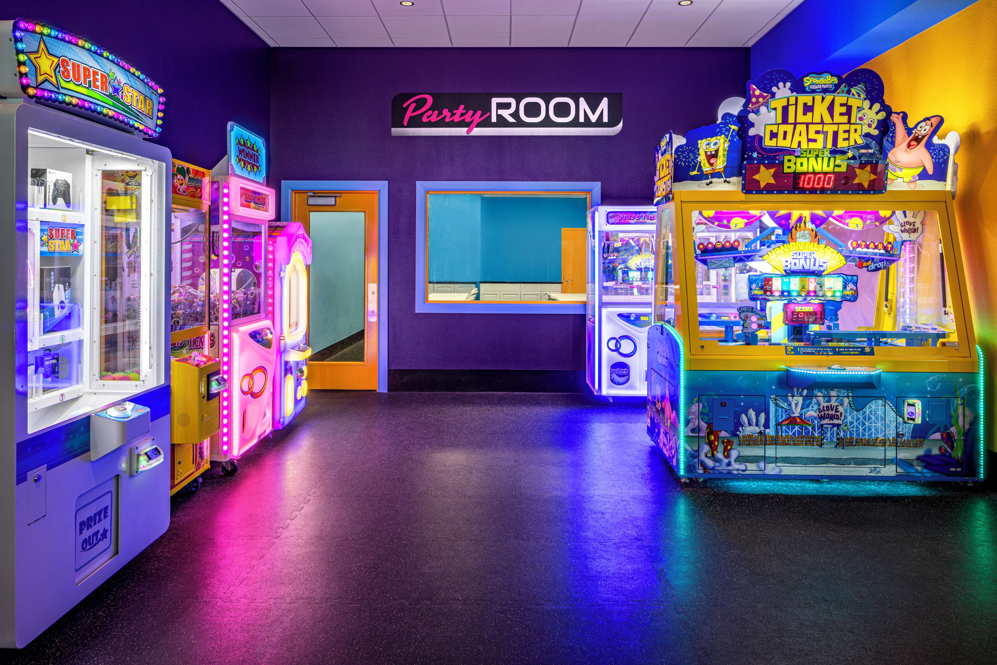 An arcade area with various gaming machines, a 'Party Room' sign, and a 'Ticket Coaster' game.