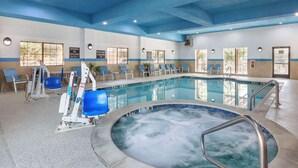 A swimming pool area with a hot tub, exercise equipment, and seating. - Best Western Plus Mansfield Inn & Suites (Mansfield)