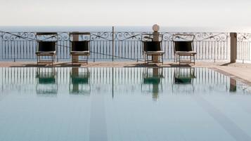 Seasonal outdoor pool, open 7 AM to 7 PM, pool umbrellas, sun loungers