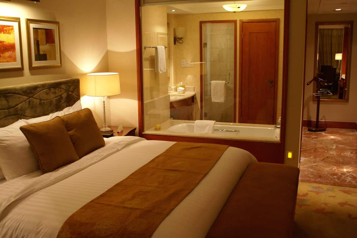 new century lake-view king room | bathroom | separate bathtub and shower, rainfall showerhead, free toiletries