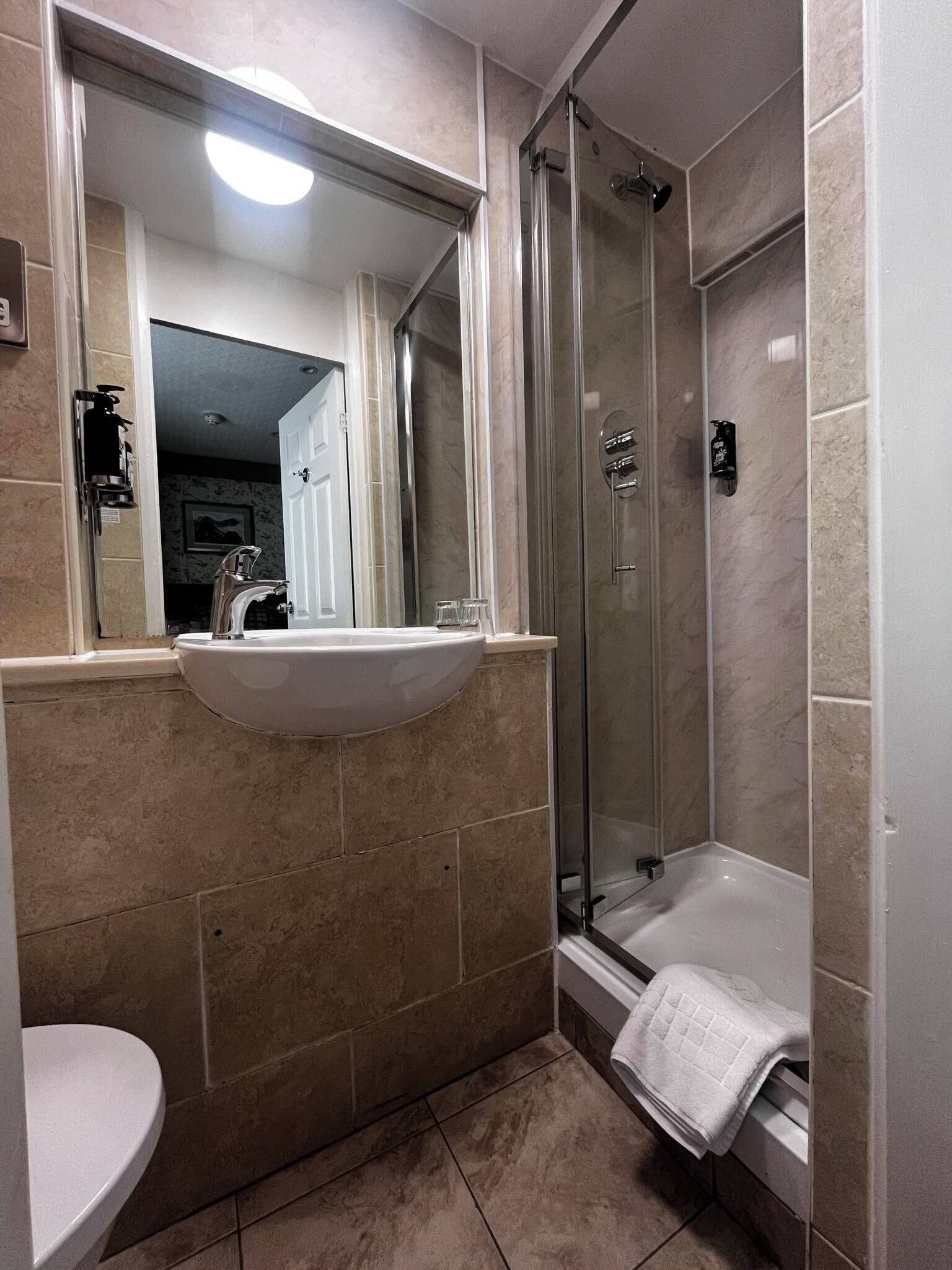 small single room | bathroom | shower, free toiletries, hair dryer, towels