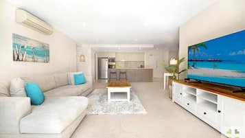 Executive Two Bedroom Apartment | Living area | Flat-screen TV