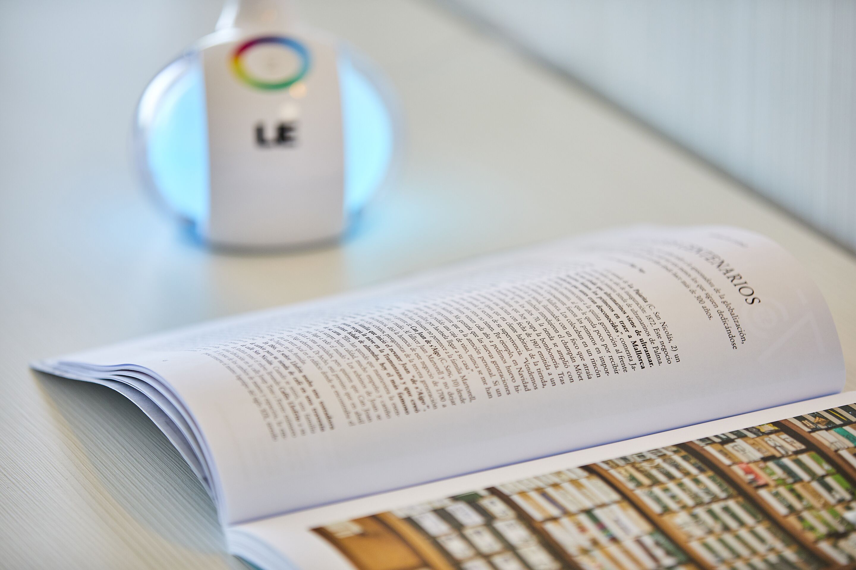 An open book with text on a table.