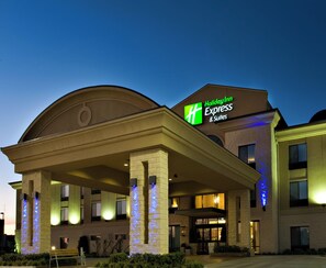 A Holiday Inn Express & Suites building with a covered entrance and illuminated signage. - Holiday Inn Express & Suites Wichita Falls by IHG (Wichita Falls)