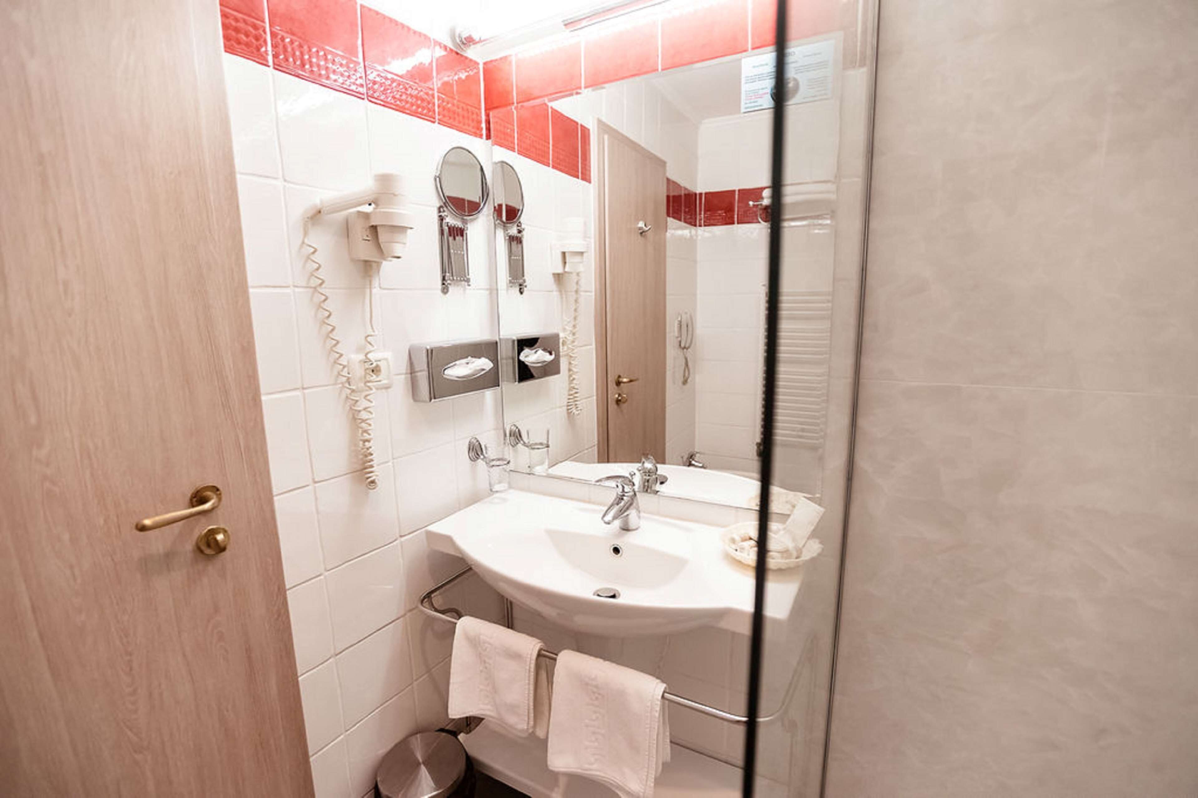 deep-soaking bathtub, rainfall showerhead, hair dryer, bathrobes