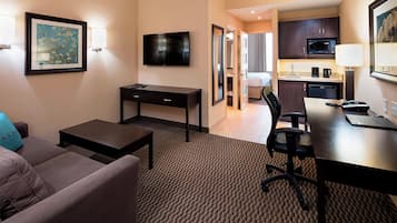 Premium bedding, desk, laptop workspace, blackout drapes