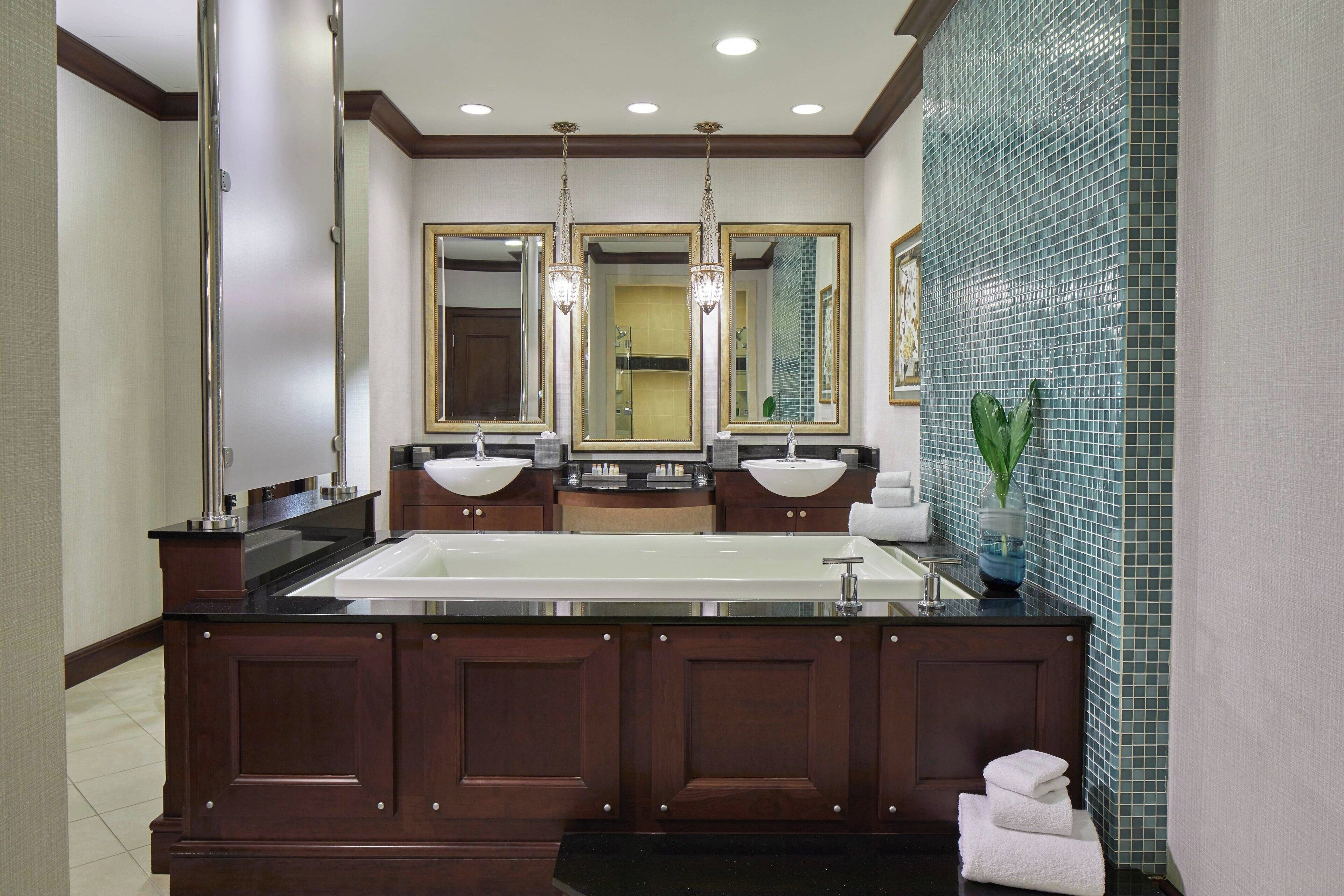 separate bathtub and shower, hair dryer, towels