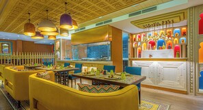 4 restaurants, breakfast, lunch, dinner served; Indian cuisine