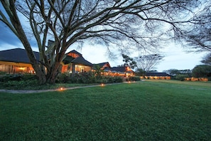 Stroll through the beautifully maintained grounds of this serene estate, surrounded by mature trees and expansive lawns.