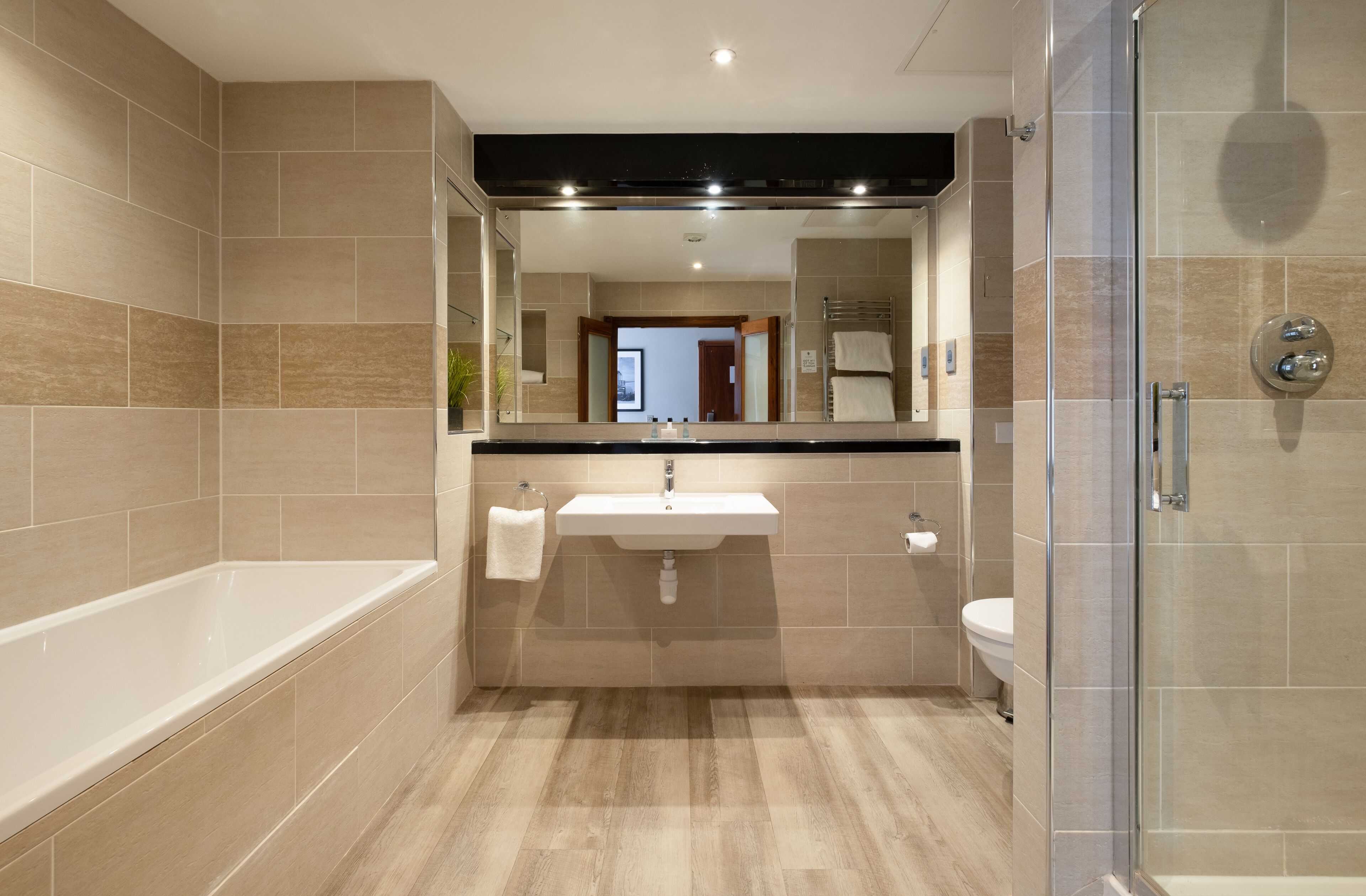 junior suite | bathroom | separate bathtub and shower, free toiletries, hair dryer, towels