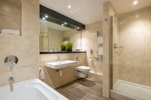 Separate bathtub and shower, free toiletries, hair dryer, towels