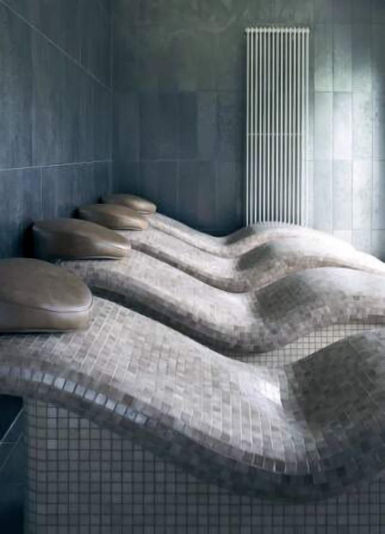 A sauna with multiple benches and a ventilation system.