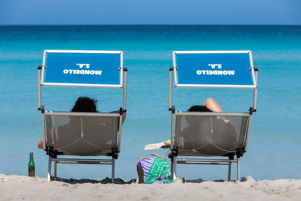 Beach nearby, white sand, sun loungers, beach umbrellas