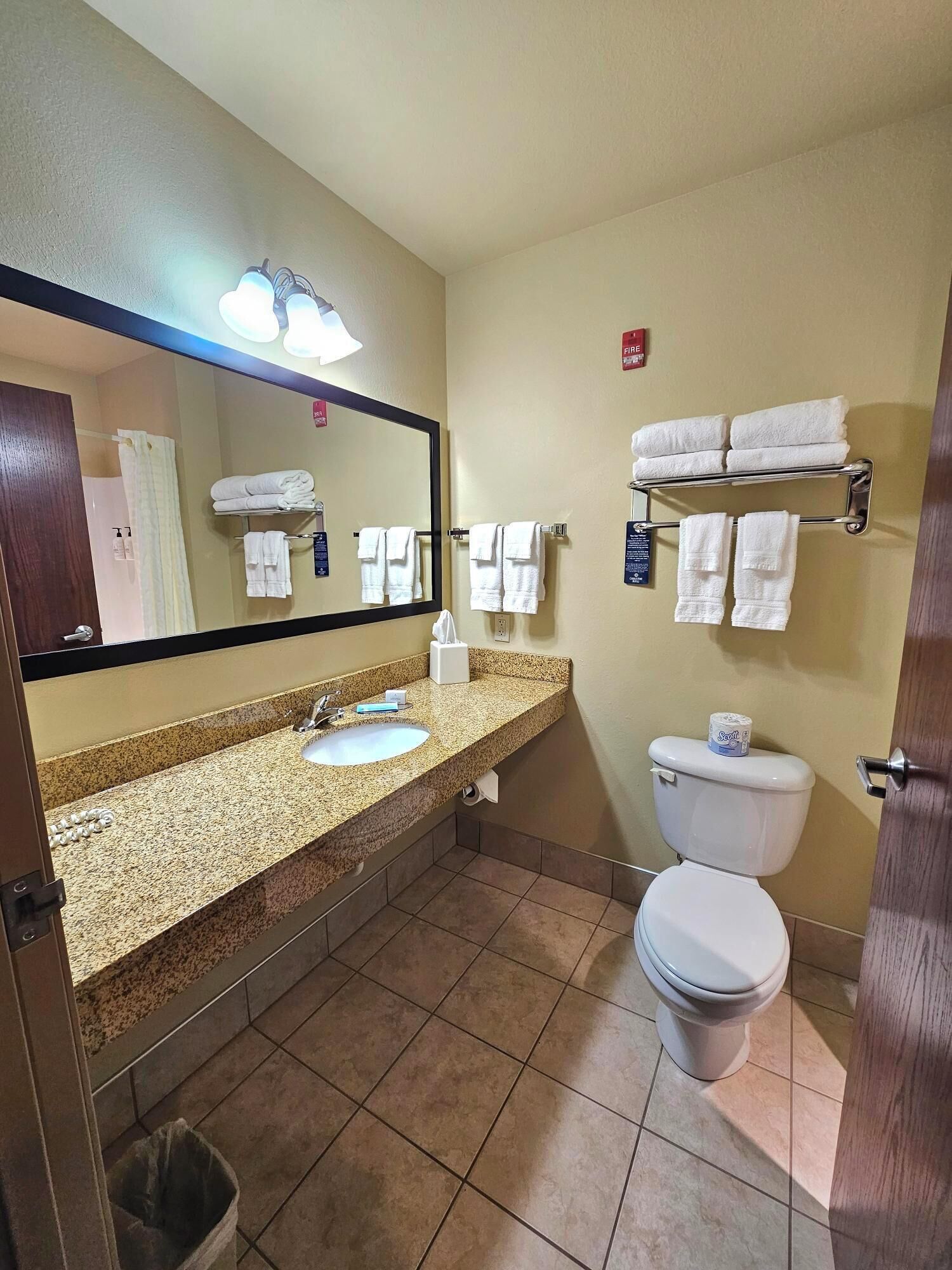 combined shower/bathtub, designer toiletries, hair dryer, towels