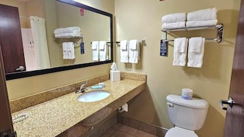 Combined shower/tub, designer toiletries, hair dryer, towels