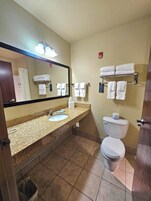 Combined shower/tub, designer toiletries, hair dryer, towels