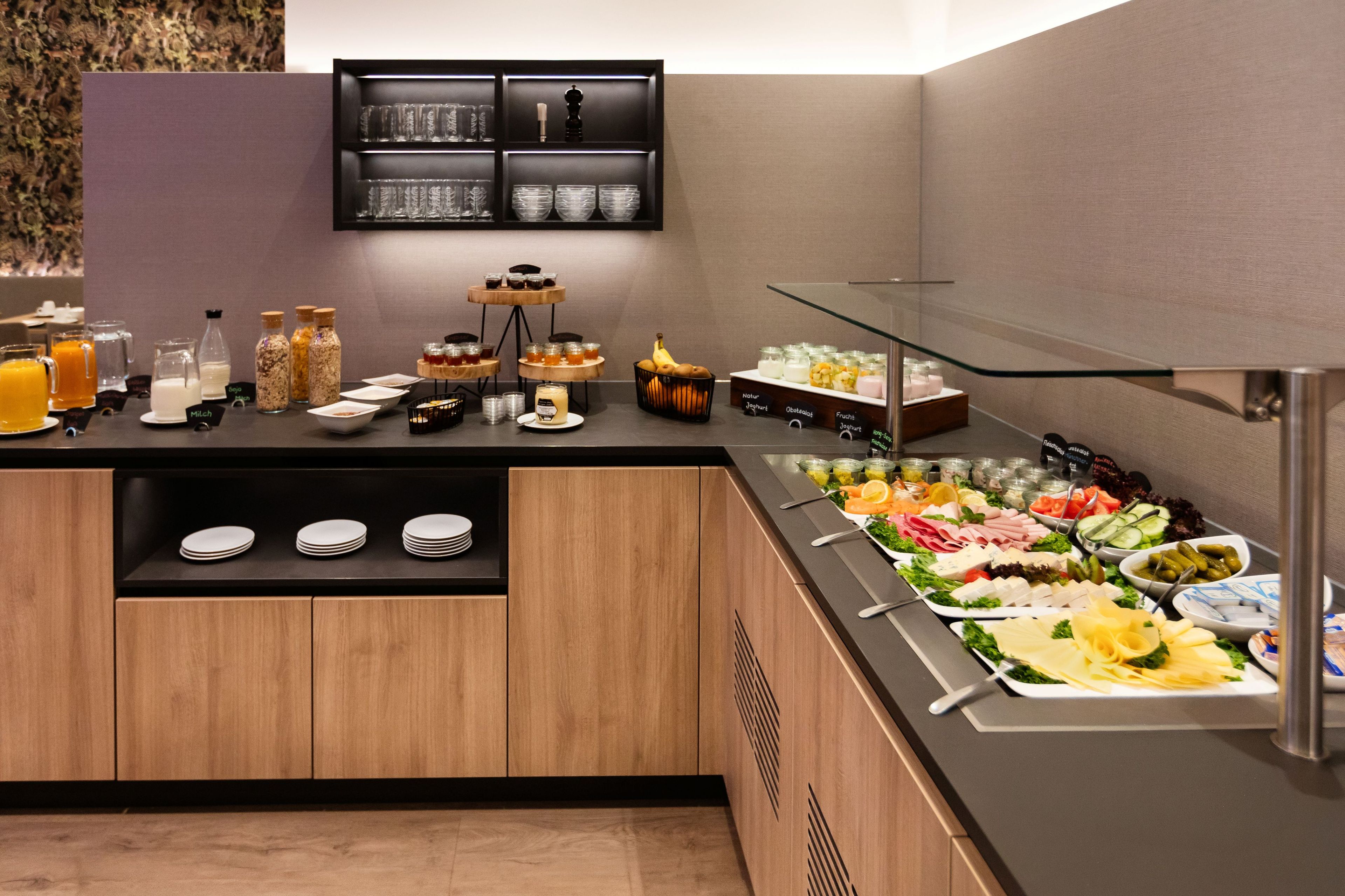 A buffet setup with various food items and beverages.