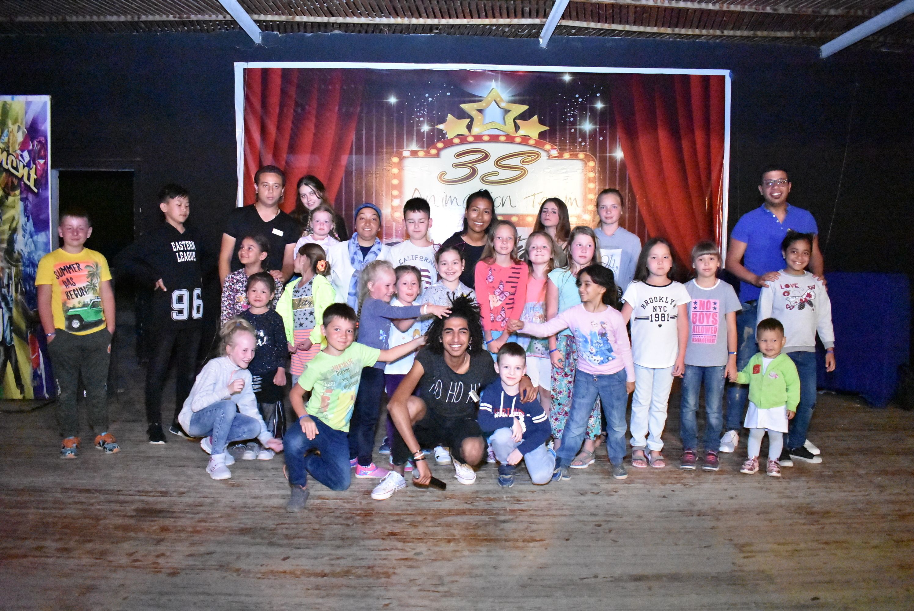 A group of people posing in front of a backdrop with the number 35 and the text "Animation Team".