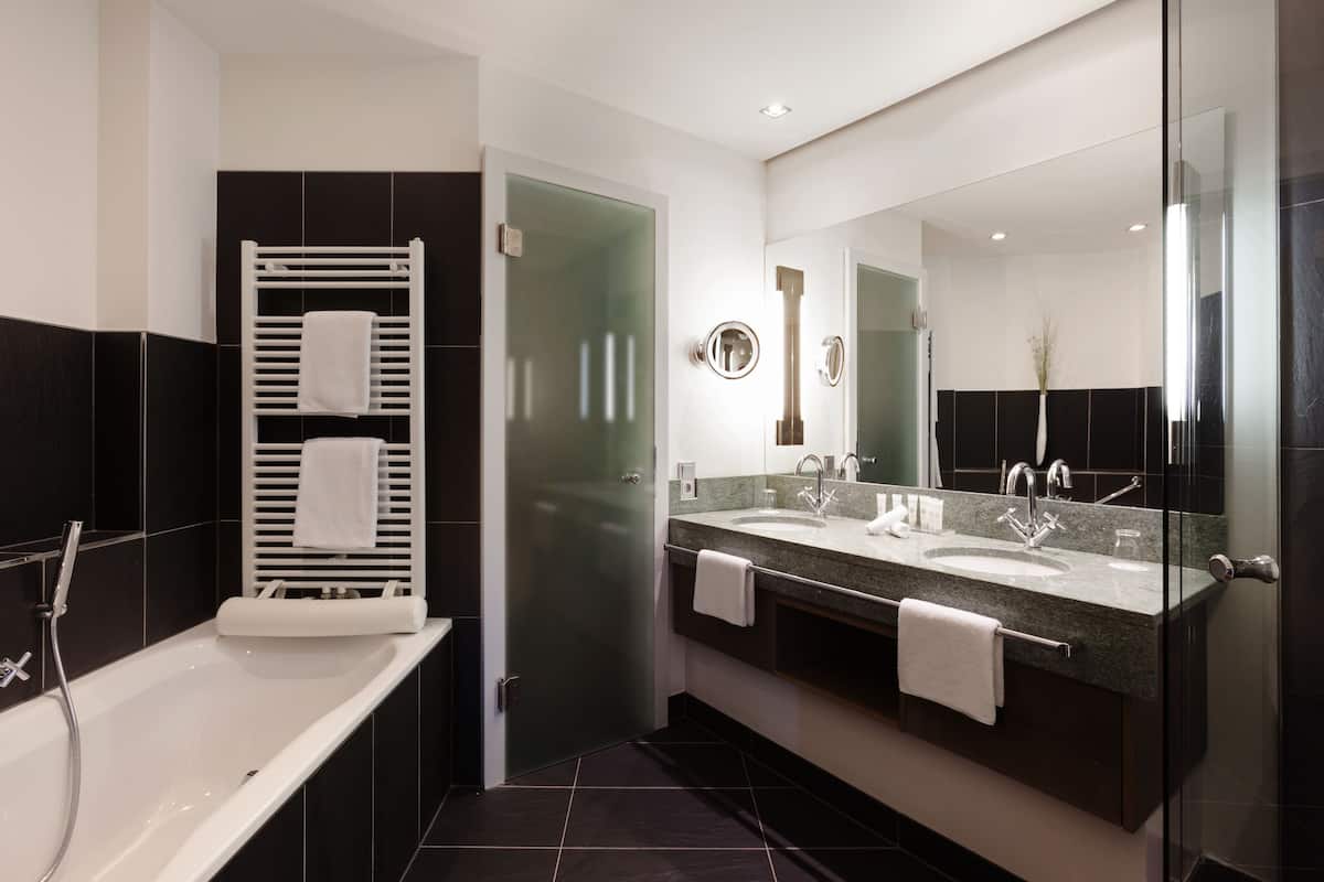 suite | bathroom | separate bathtub and shower, deep-soaking bathtub, rainfall showerhead