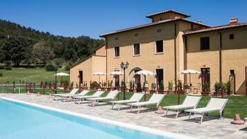 Seasonal outdoor pool, open 8:00 AM to 8:00 PM, pool umbrellas