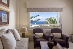 Superior Suite, Sea View | Living area | Flat-screen TV