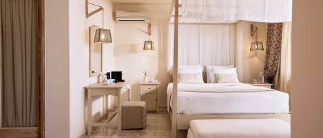 A bedroom with a bed, bedside tables, a desk, an air conditioning unit, and a window with curtains.