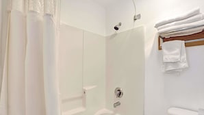 A bathroom with a shower, toilet, and towel rack. - Days Inn by Wyndham Seattle North of Downtown (Seattle)