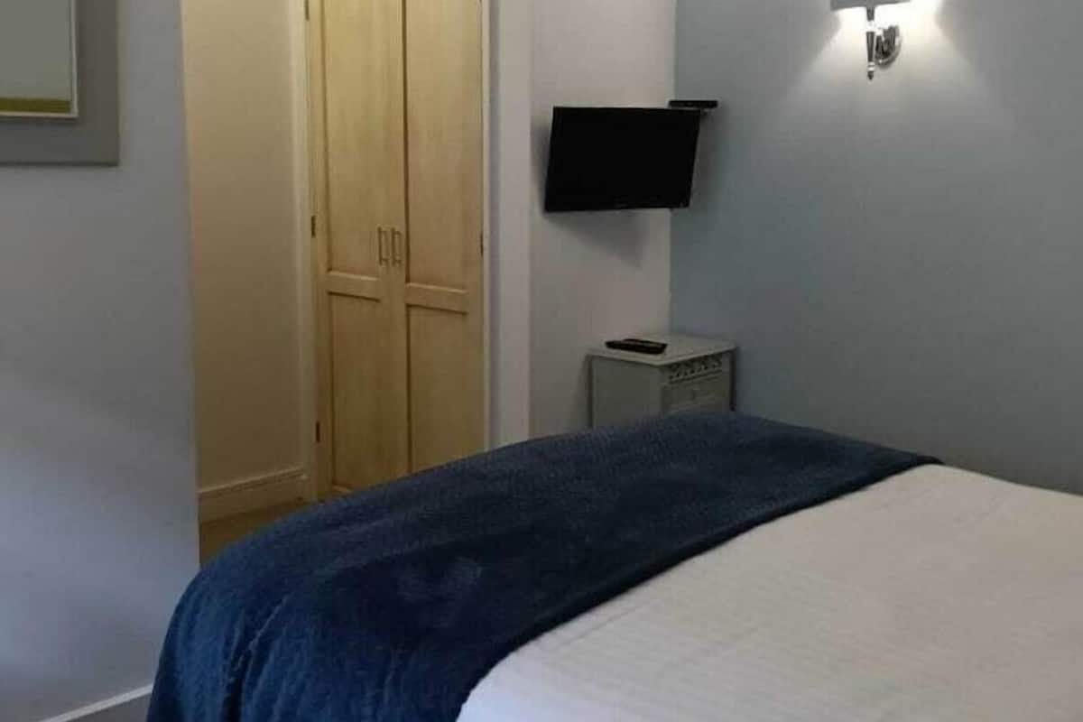 Ropa de cama de alta calidad y tabla de planchar con plancha