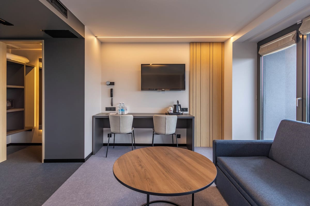 premium double room | living area | plasma tv