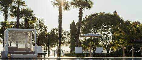 Indoor pool, seasonal outdoor pool, pool umbrellas, pool loungers