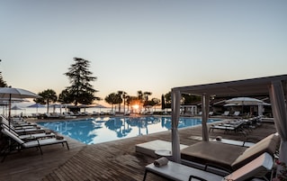 Indoor pool, seasonal outdoor pool, pool umbrellas, sun loungers