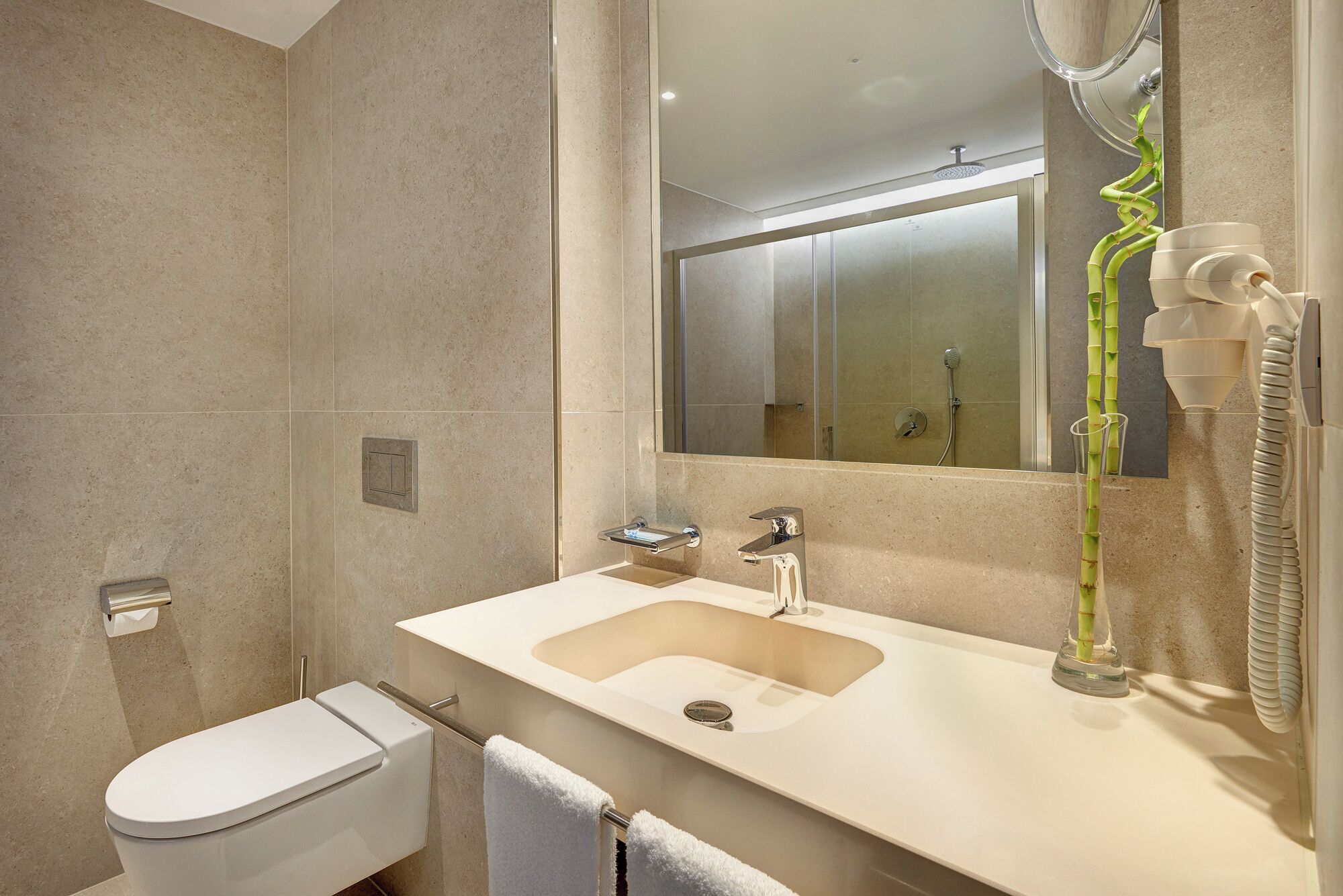 shower, rainfall showerhead, hair dryer, towels