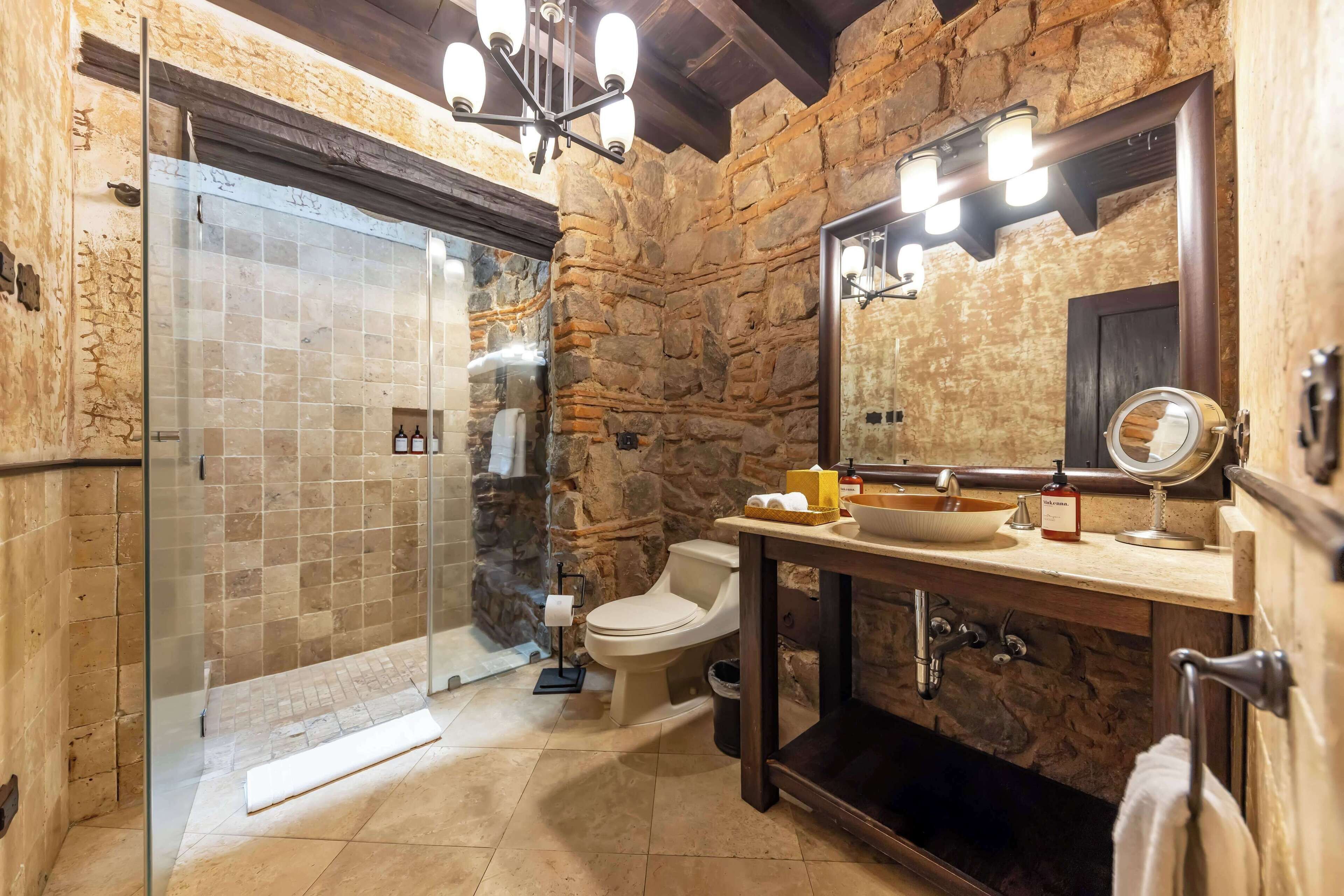 rainfall showerhead, hair dryer, bathrobes, towels