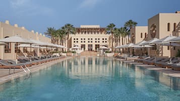 2 outdoor pools, pool umbrellas, pool loungers