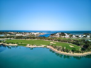 A coastal resort with a golf course, a marina, and a large body of water. - Steigenberger Golf Resort El Gouna (El Gouna)