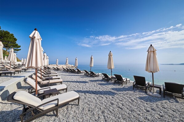 Private beach, white sand, free beach shuttle, beach cabanas