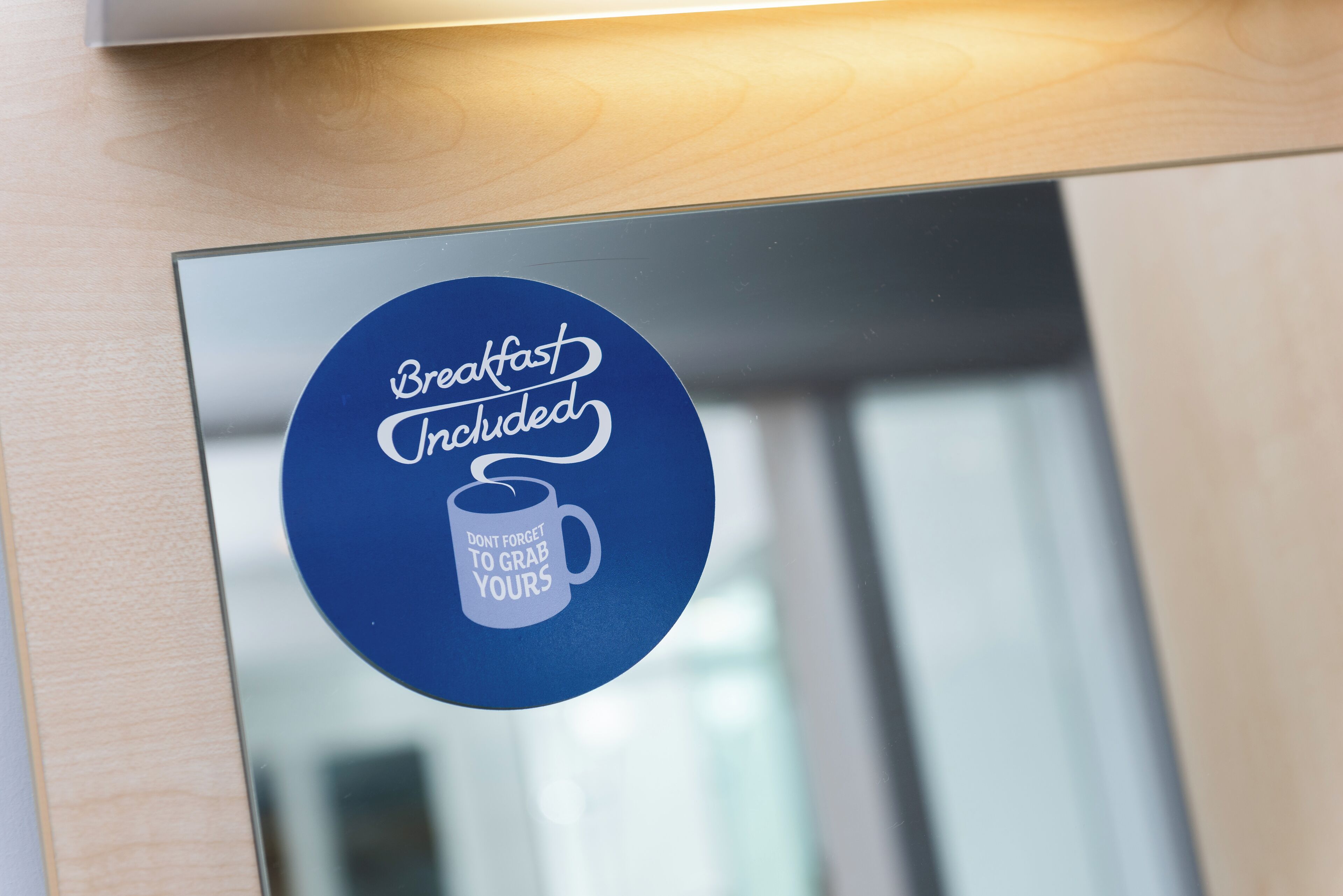 A sign indicating breakfast is included.