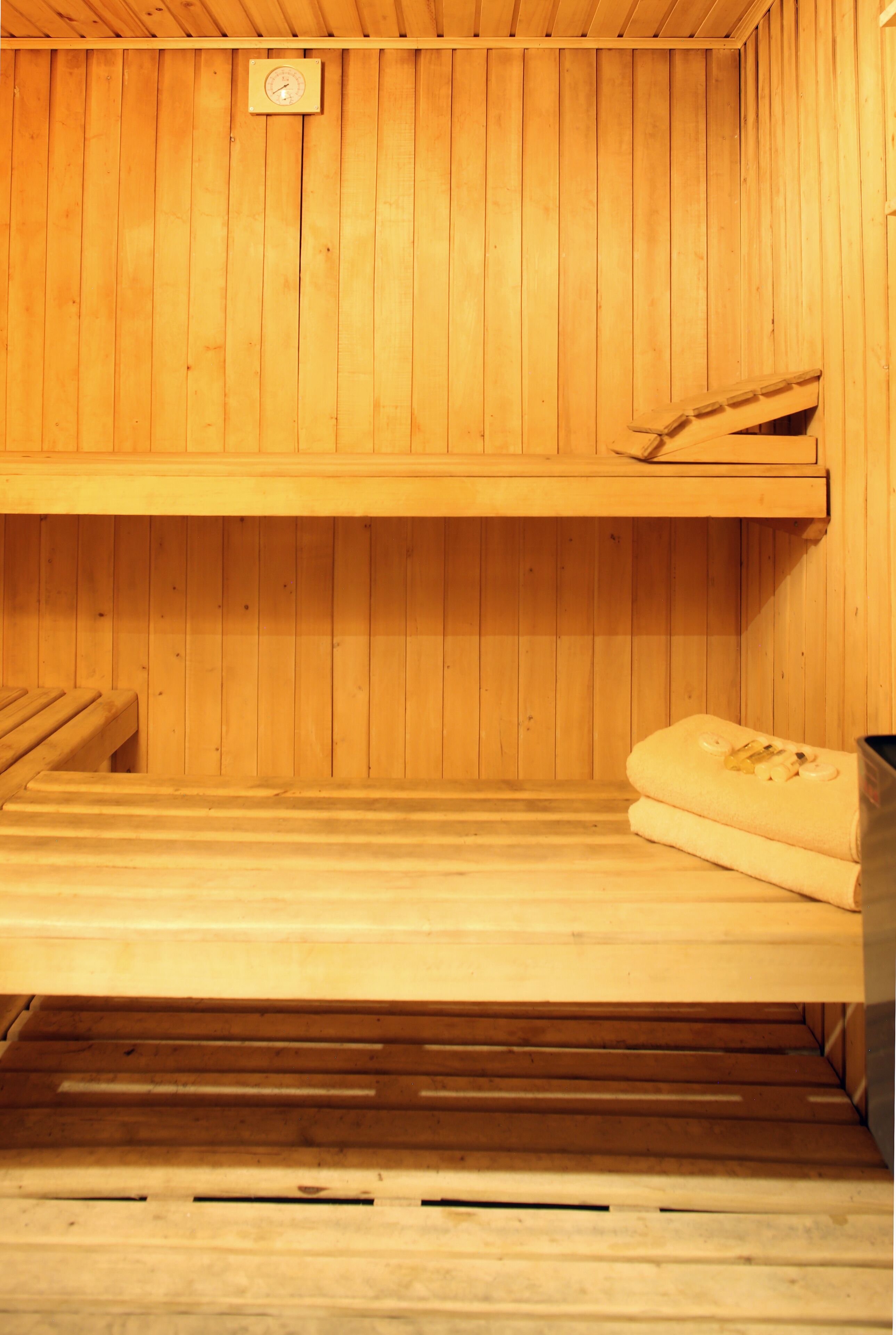 A sauna with wooden walls and benches.