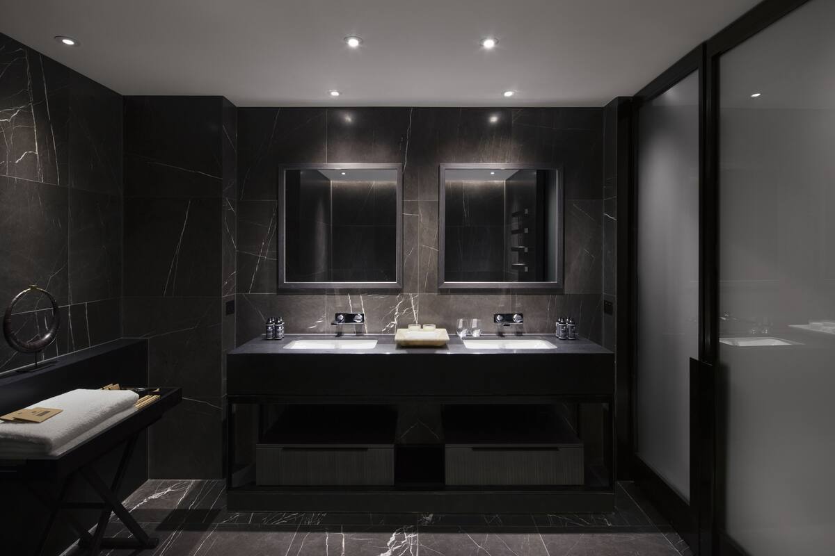 designer toiletries, hair dryer, bathrobes, slippers