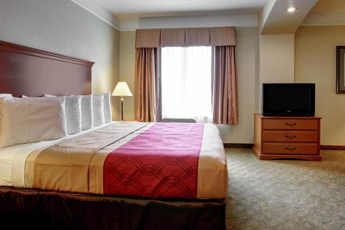 Desk, laptop workspace, blackout drapes, iron/ironing board