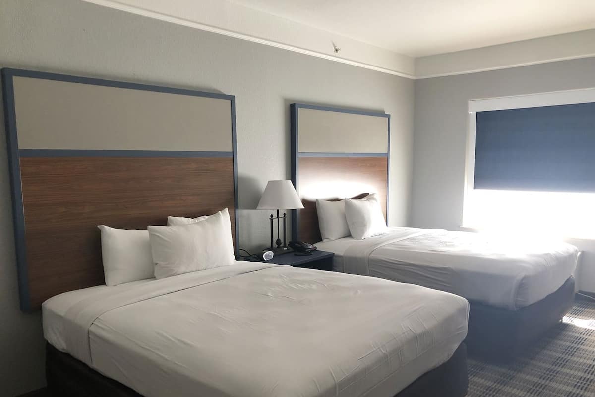 Desk, laptop workspace, blackout drapes, iron/ironing board