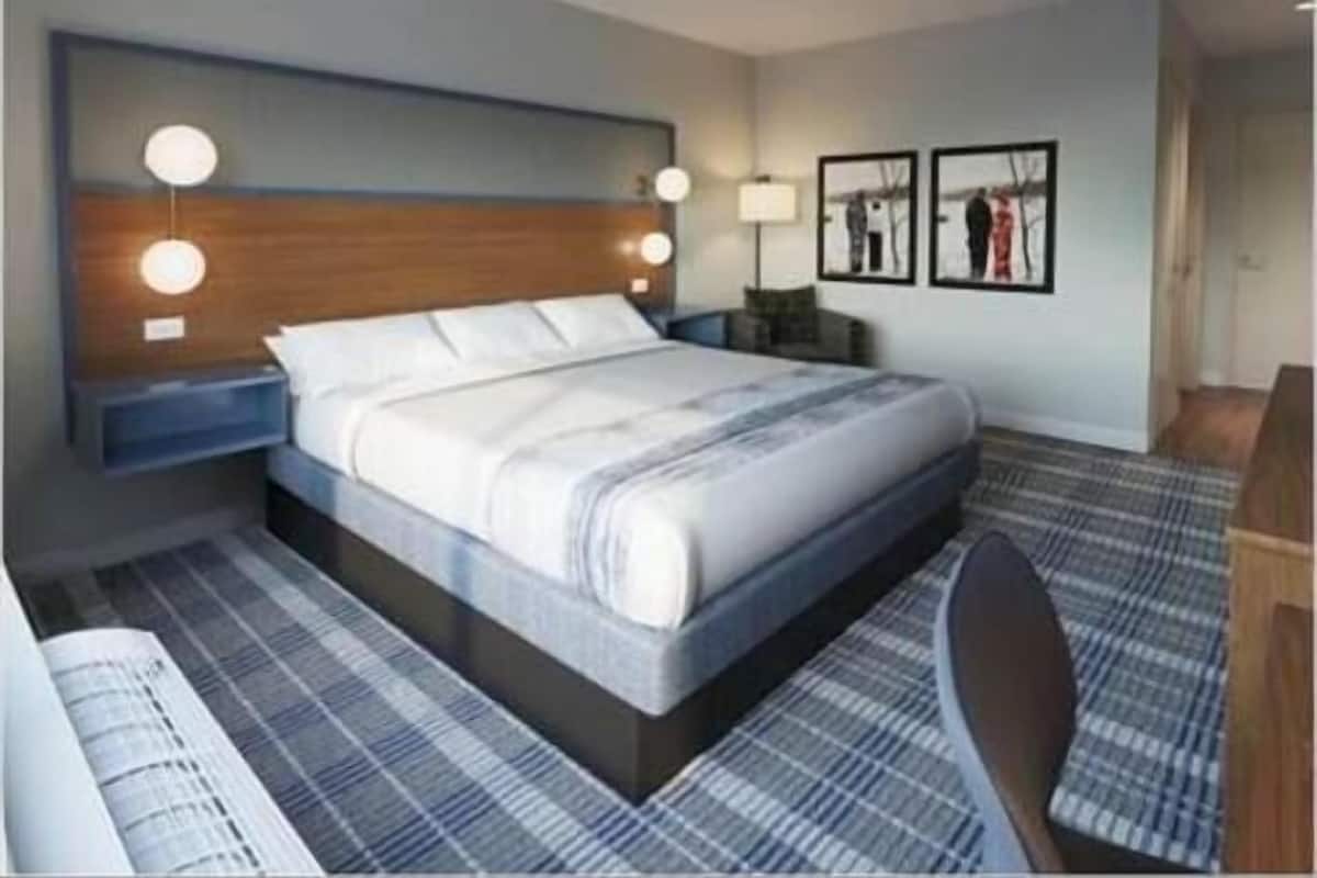 Desk, laptop workspace, blackout drapes, iron/ironing board